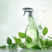 An eco friendly cleaning concept showcasing a spray bottle filled with cleaning solution placed on a light background, accompanied by flying green leaves. Symbolizing environmentally conscious
