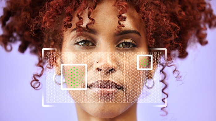 Woman getting skin analyzed