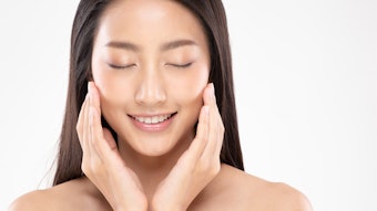 Beautiful Asian young woman touching soft cheek smile with clean and fresh skin Happiness and cheerful with positive emotional,isolated on white background,Beauty and Cosmetics Concept