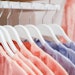 Womens pajamas hang on store hangers. Selling womens pajamas in the market. Advertising, sale, fashion concept. Dresses in a row