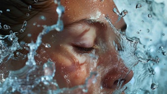 Woman getting splashed with water