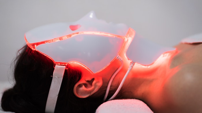 Woman with LED Mask On