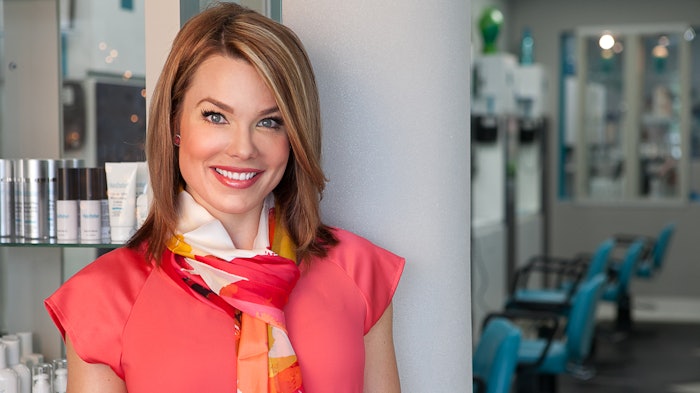Picture of Jaclyn Peresetsky wearing a pink top in a salon
