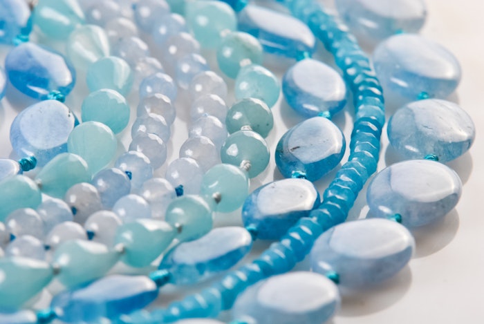Variation of aquamarine semi precious jewelry background