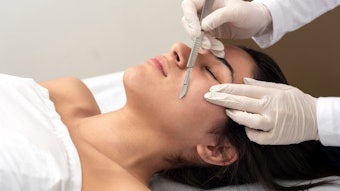 Woman receiving a dermaplaning service in the spa