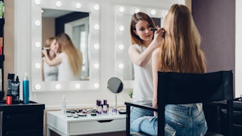 Makeup artist on site doing makeup