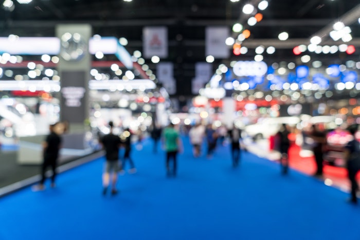 People buzzing on a tradeshow floor