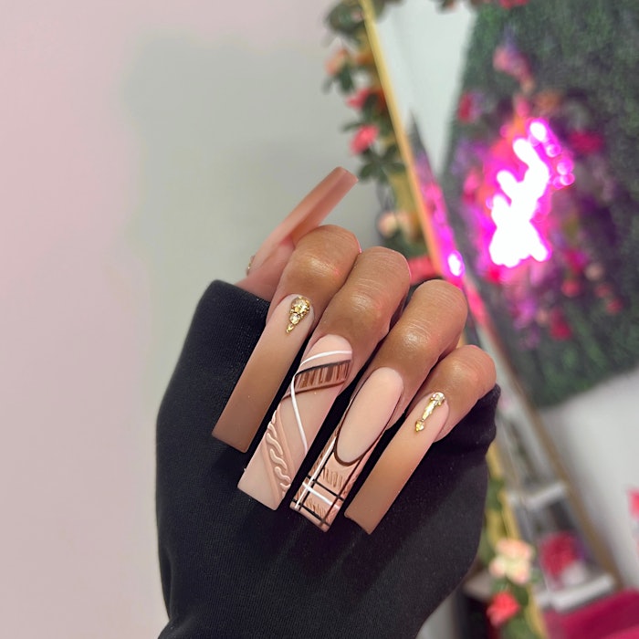 The autumn matte nail design was inspired by earthy tones and cozy sweater vibes.