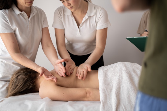 Spa technicians participating in a class