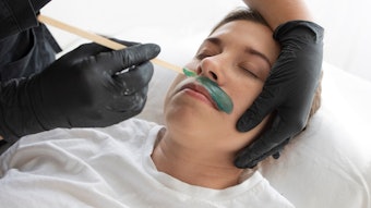 Woman getting her lip waxed at the spa