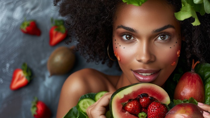 Woman with radiant skin enjoying a healthy meal filled with fresh fruits and vegetables, promoting clear skin from the inside out.