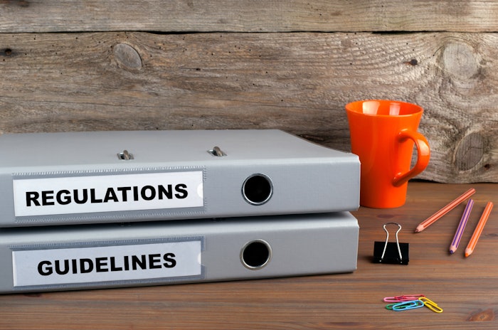 Regulations books on a desk