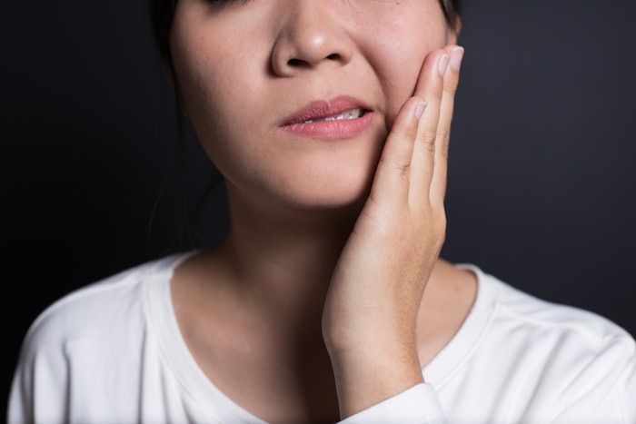 Person touching their face