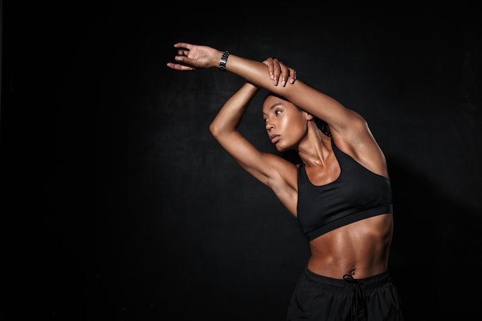 Confident fit young african fitness woman