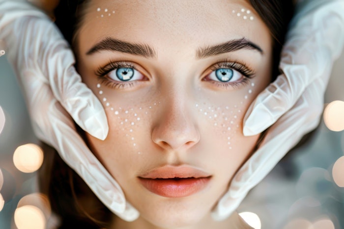 Women during a treatment at the spa with microbes on her face