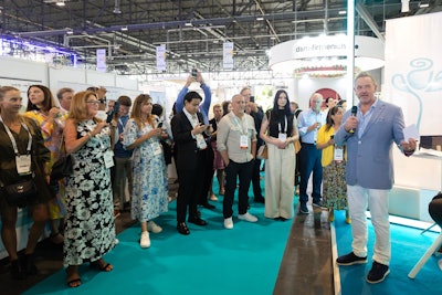 American Society of Perfumers' president James Krivda (pictured) welcoming attendees to the society's World Perfumery Congress booth.