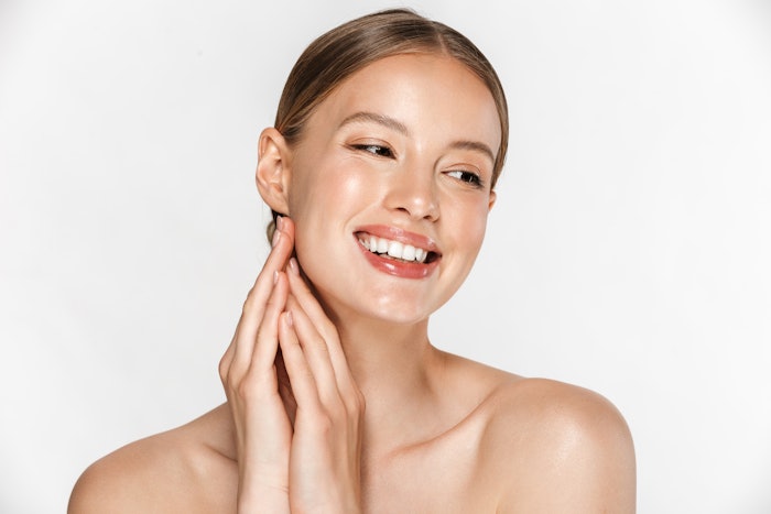 Women with a clean makeup look smiling