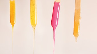 Wax dripping off of four sticks