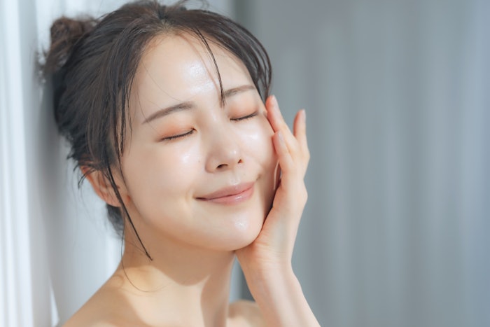 Woman with glass skin in the spa