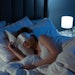 Woman sleeping in a hotel with an eye mask on