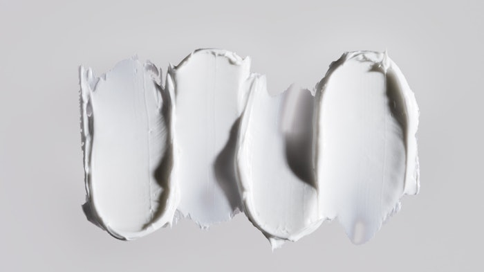 skin care white cream texture scoop