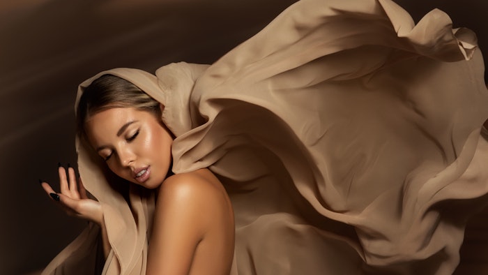 woman luxury wrapped brown silk