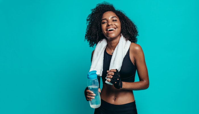 Happy woman resting after workout