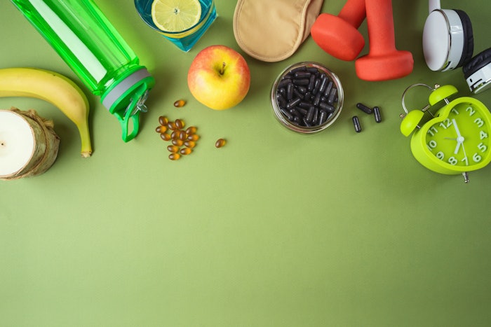 Biohacking concept treatment with sports exercise, healthy diet, sleep, music and vitamins.