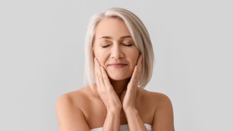 woman touching her face