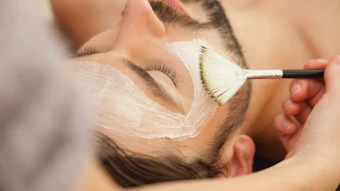 Man having a facial mask at the spa