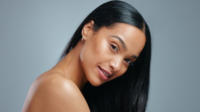 woman with beautiful long brown hair healthy shiny turned to the side