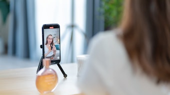 Woman doing a skin care blog at the spa