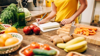 Female person cooking on the kitchen, bio food