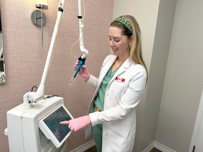 Alexandra Bowles using the FemTouch laser.