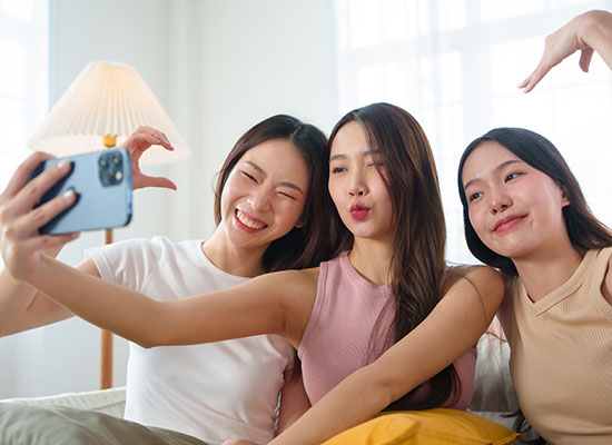 Three Friends Taking A Selfie 65e4539038afbc
