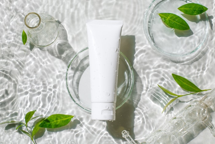 Green Leaves Lab Glassware Watery Waves White Tube Natural Cosmetic Concept Adobe Stock 528125939