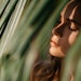 Natural Woman Beauty In Leaves Sun Shining Through Eyes Closed Adobe Stock 397528386