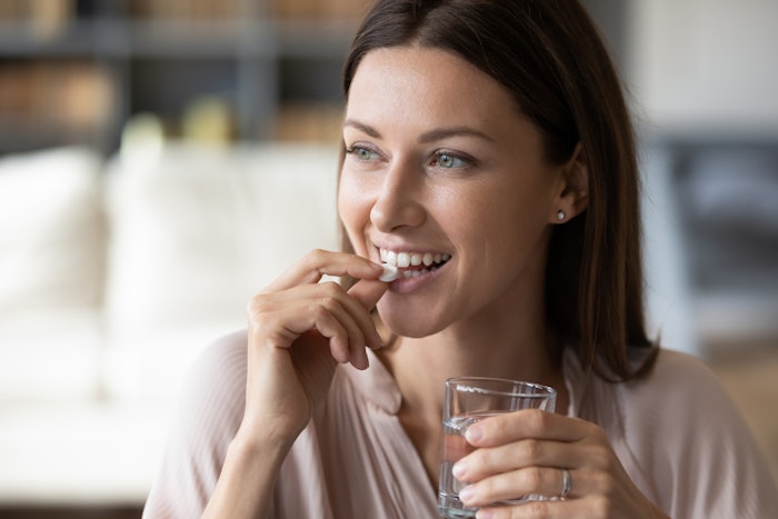 Woman Beauty Holistic Vitamin Pill Glass Of Water Adobe Stock 345241436