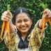 Young Woman Excited Holding Up Carrots Adobe Stock 504354316
