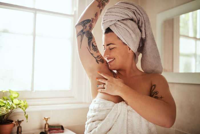 Woman In Bathroom Arm Up Feeling Pit, Towel On Head Tattoo Arms Adobe Stock 601258921