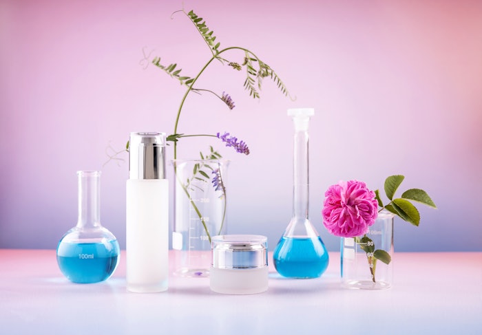 Products Beakers Floral Blue Liquid Pink Background Adobe Stock 524695694