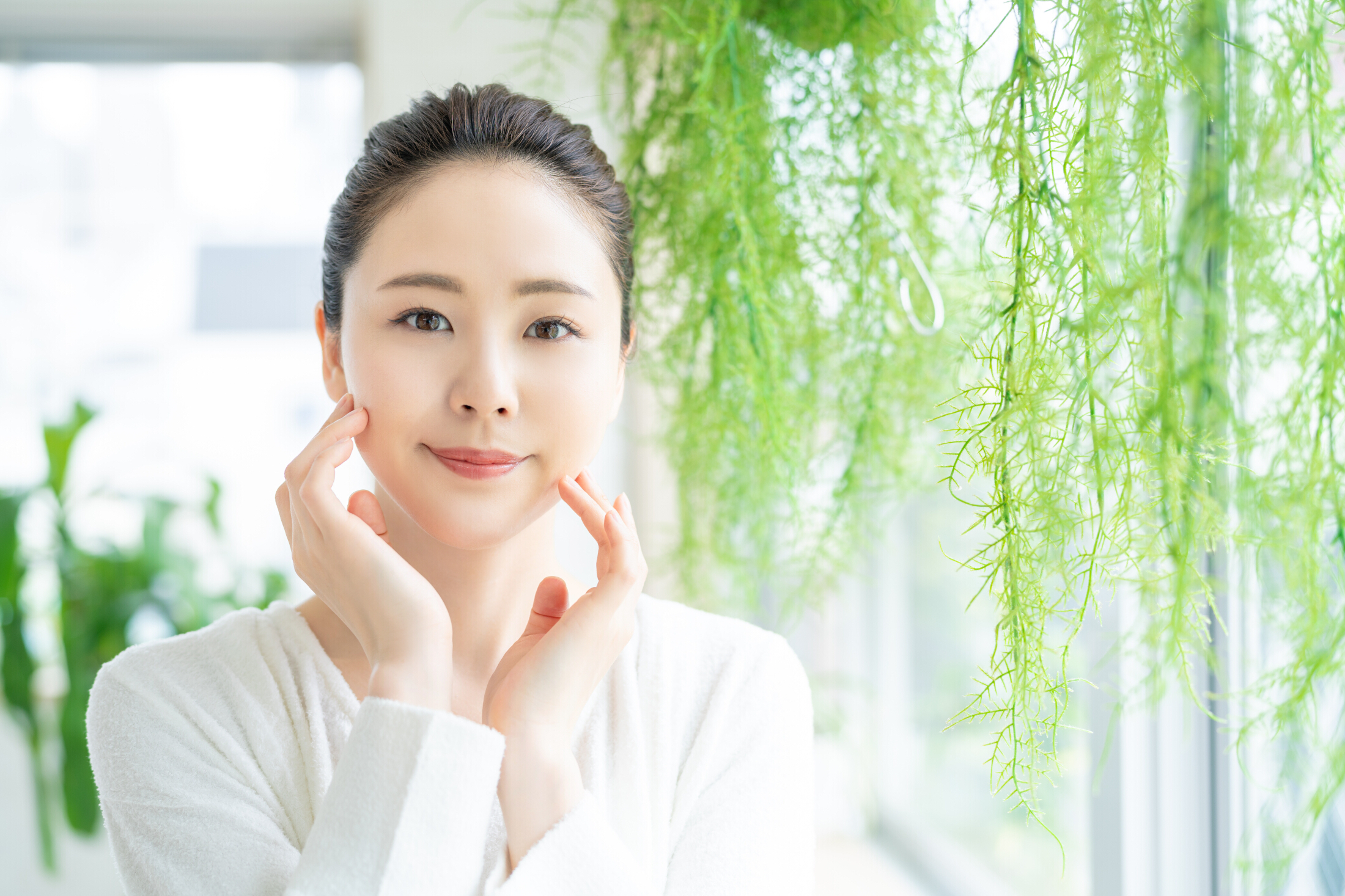 Beautiful Asian Woman White Background Bright Plants Hanging Nearby Natural Skin Care Concept Adobe Stock 278715489