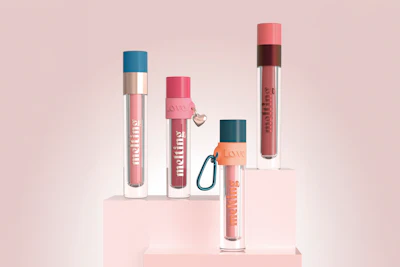 LIPLAb shifts attention to liquid and hybrid lip formulas, with standout designs such as the Unique Gloss—customizable with charms and silicone rings and adaptable for lip and face use.