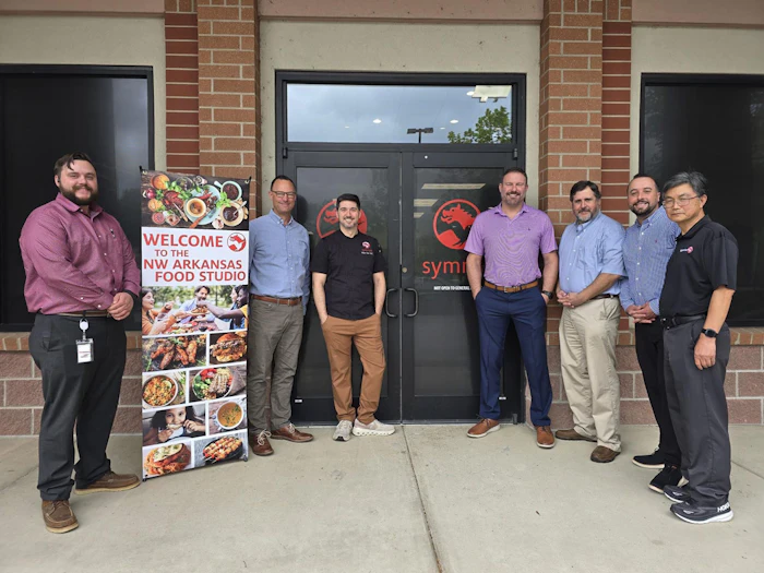 Members of Symrise's North American food and beverage team in front of the company's Northwest Arkansas Food Studio: Will Bryles - key account manager; Craig Biggers, VP of food BU; Vince Fazi, senior product development chef; Scott Haddox, senior account director; Ed Yancey, principle scientist; John Selser, key account mnanager; and Yongcheng Liu, principal scientist.