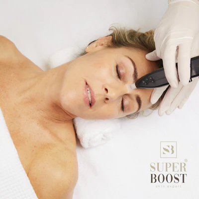 Professional facial treatment with handheld device on relaxed client during skincare procedure