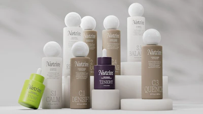 Nutrice skincare product collection featuring multiple bottles and containers with white spheres arranged on white platforms