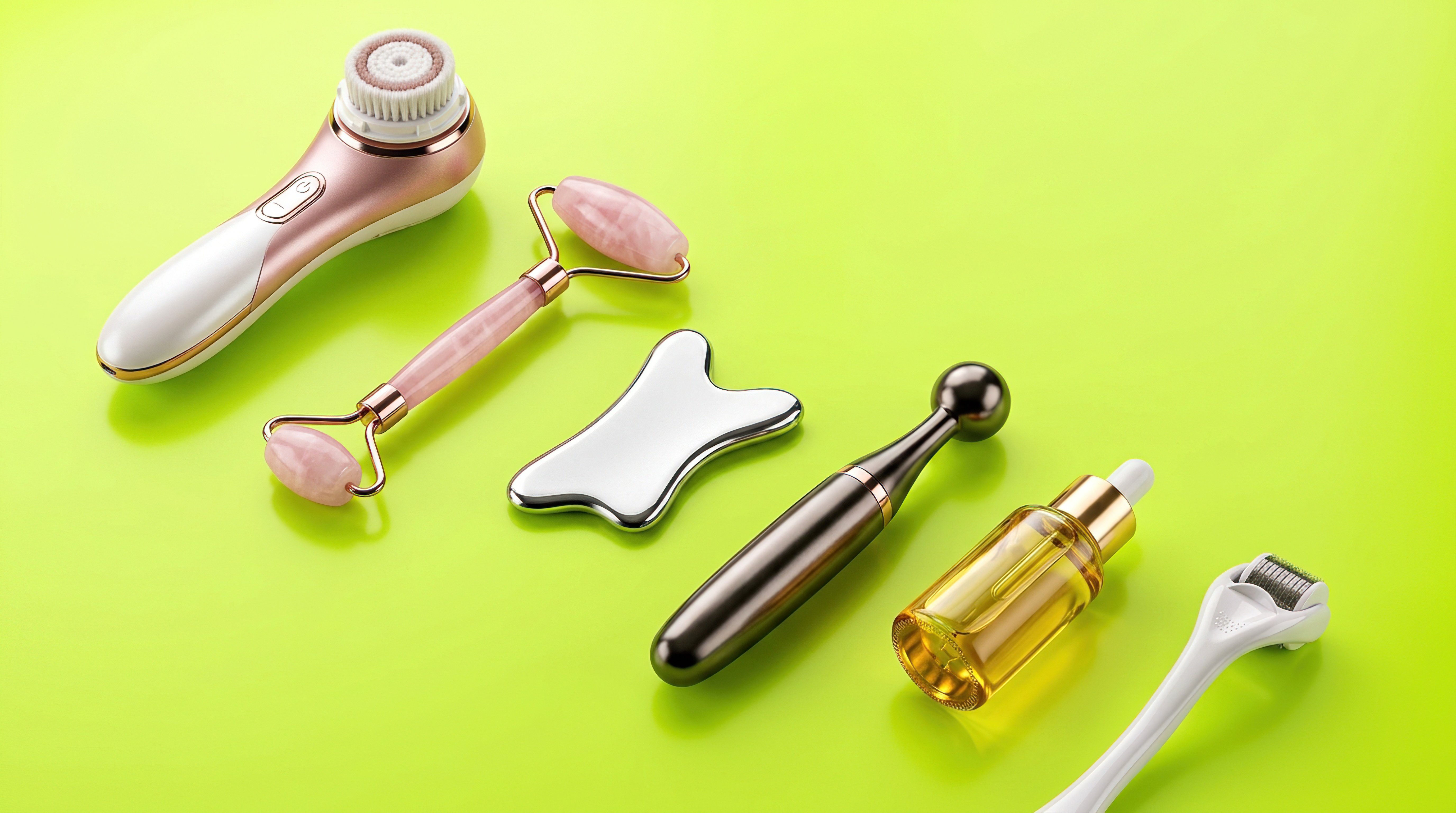 Collection of skincare tools including facial cleansing brush, rose quartz roller, gua sha stone, and derma roller on lime green background